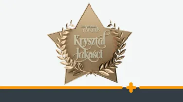 Złoty emblemat nagrody w kształcie gwiazdy z wieńcem laurowym i tytułem „Kryształ Jakości”